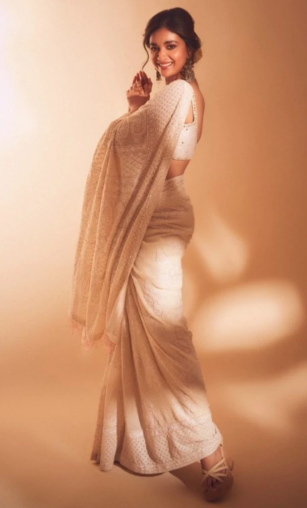 Woman in white ethnic saree